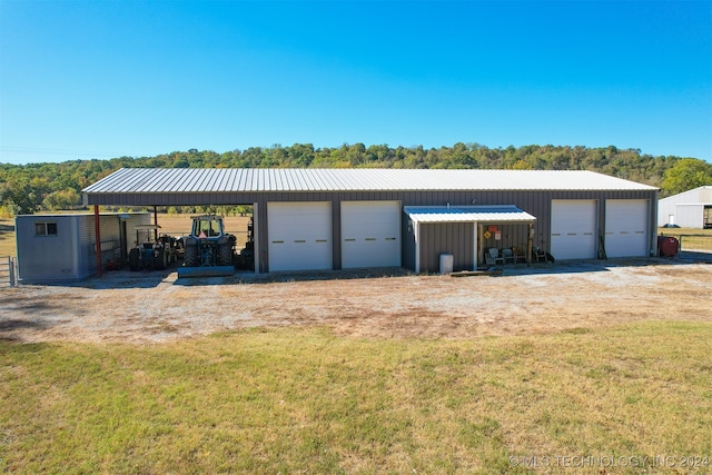 garage featuring a yard