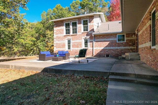 exterior space featuring a patio area and an outdoor hangout area