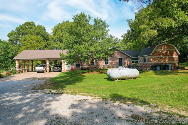 single story home with a front yard and a carport