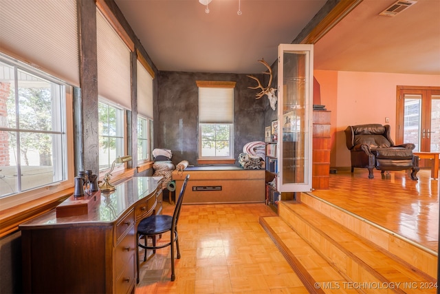 home office featuring a healthy amount of sunlight and light parquet floors