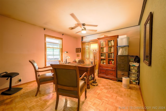 dining space with light parquet floors and ceiling fan