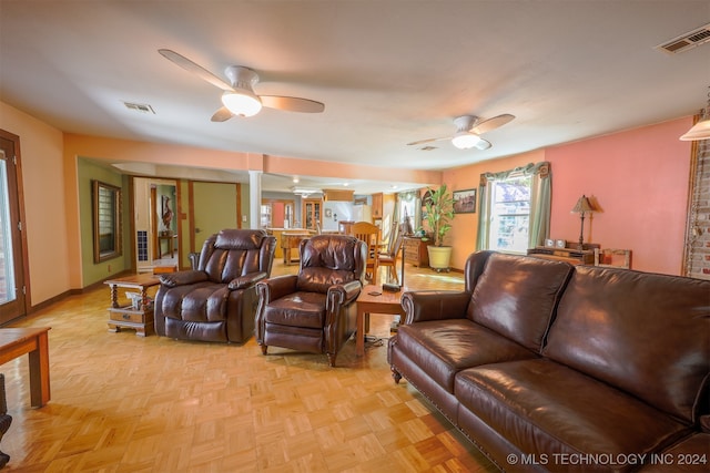 living room featuring ceiling fan and light parquet flooring