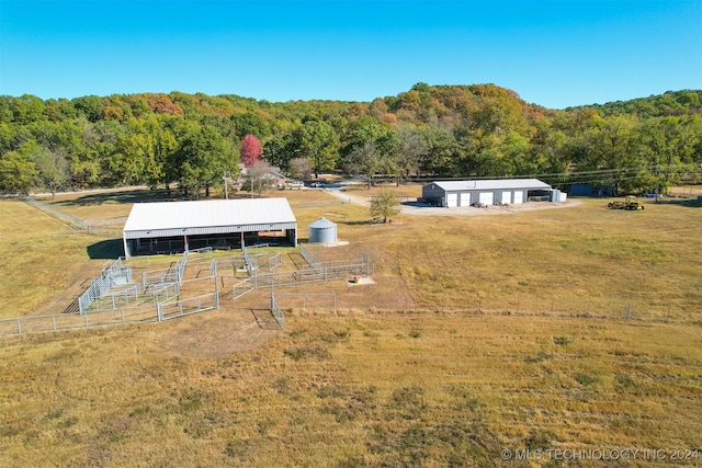 birds eye view of property featuring a rural view