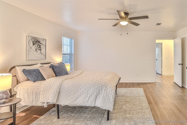 bedroom featuring ceiling fan and wood-type flooring