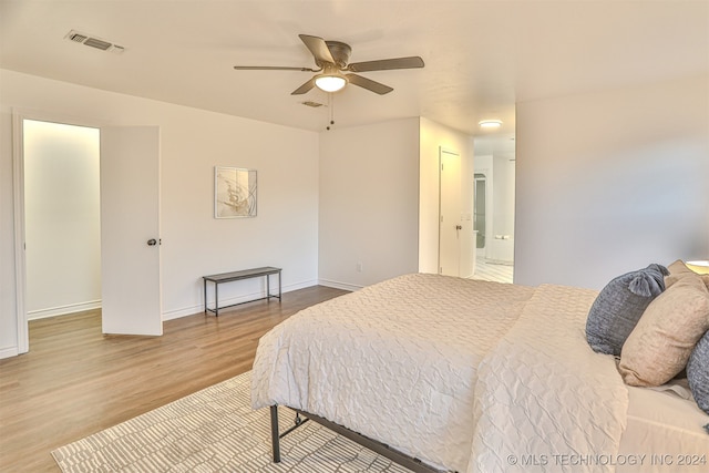 bedroom with ceiling fan and wood-type flooring