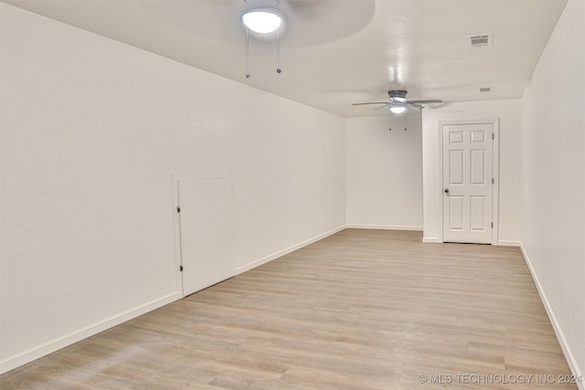 spare room featuring light wood-type flooring and ceiling fan