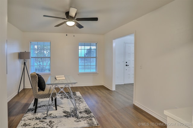 office space featuring dark wood-type flooring and ceiling fan