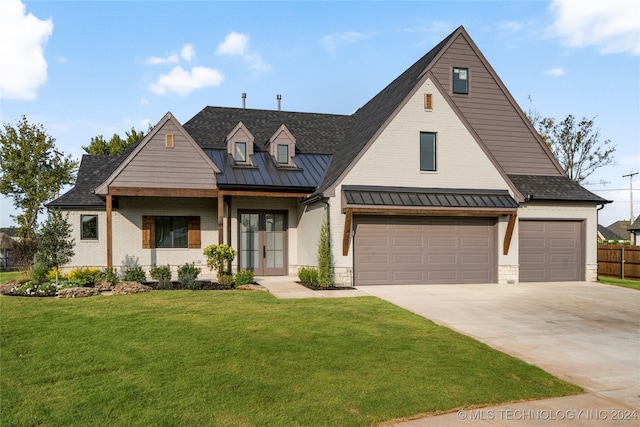 modern farmhouse style home featuring a front lawn and a garage