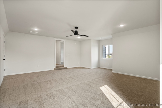 carpeted empty room with ceiling fan