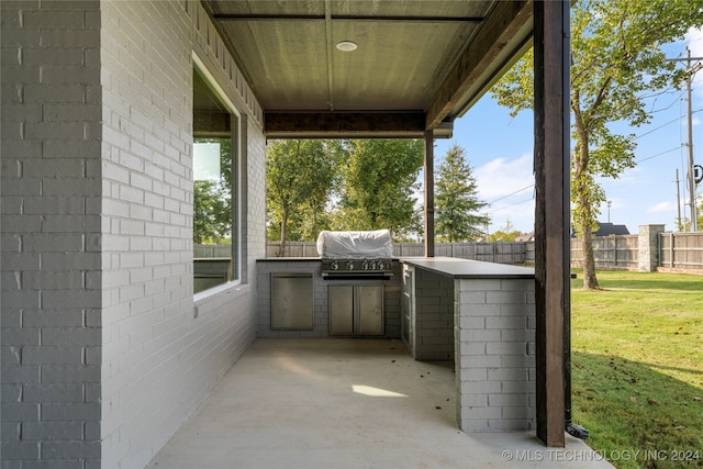 view of patio featuring grilling area and exterior kitchen