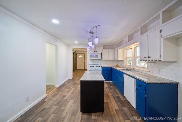 kitchen with white appliances, a center island, blue cabinets, white cabinetry, and dark hardwood / wood-style floors