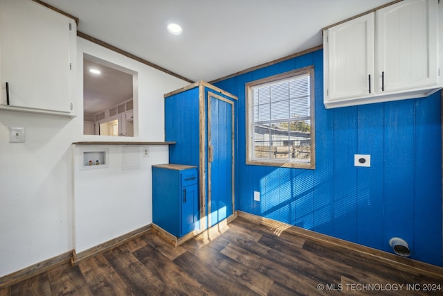 laundry room with hookup for an electric dryer, ornamental molding, dark wood-type flooring, washer hookup, and cabinets