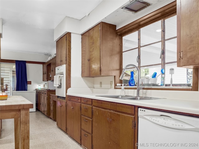 kitchen with sink and white appliances