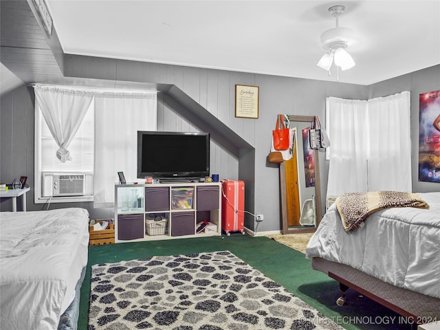 bedroom with cooling unit, carpet, and ceiling fan