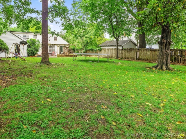 view of yard with a trampoline