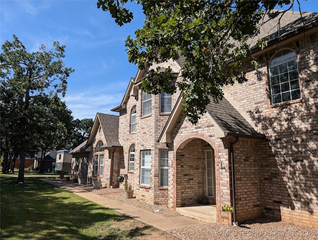 view of home's exterior with a yard