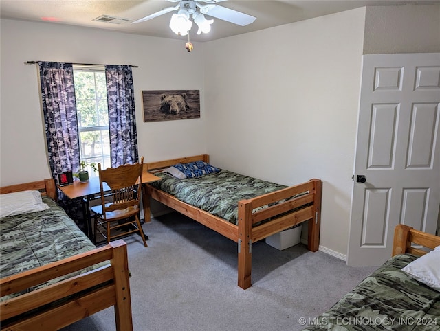 carpeted bedroom with ceiling fan