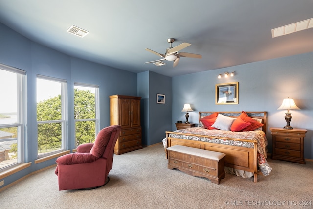 bedroom with light colored carpet and ceiling fan