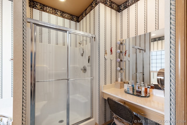 bathroom featuring vanity and a shower with shower door