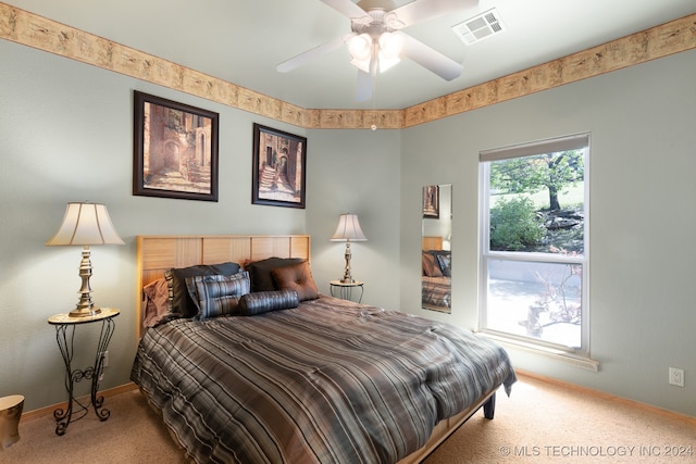 carpeted bedroom featuring ceiling fan