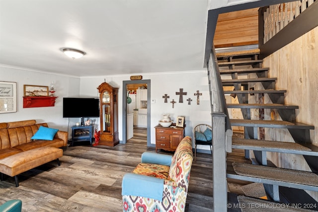 living room with crown molding and dark hardwood / wood-style flooring