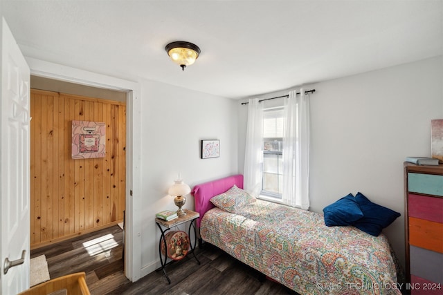 bedroom featuring dark wood-type flooring