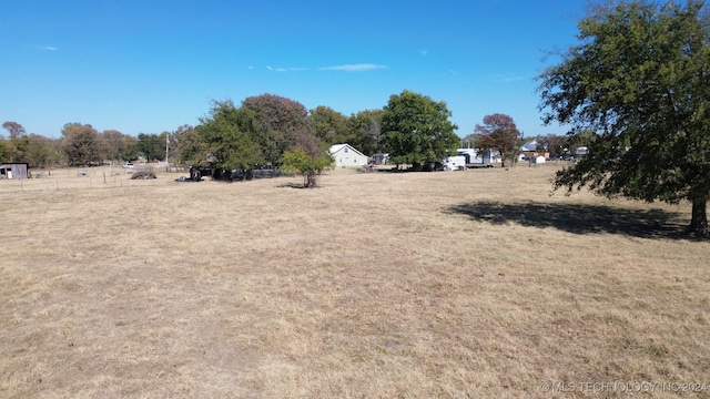 view of yard with a rural view