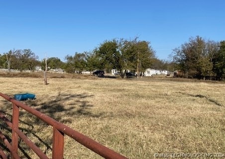 view of yard with a rural view