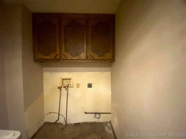 laundry room featuring hookup for a washing machine, cabinets, and hookup for an electric dryer