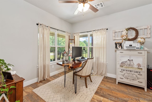 office with ceiling fan and hardwood / wood-style floors