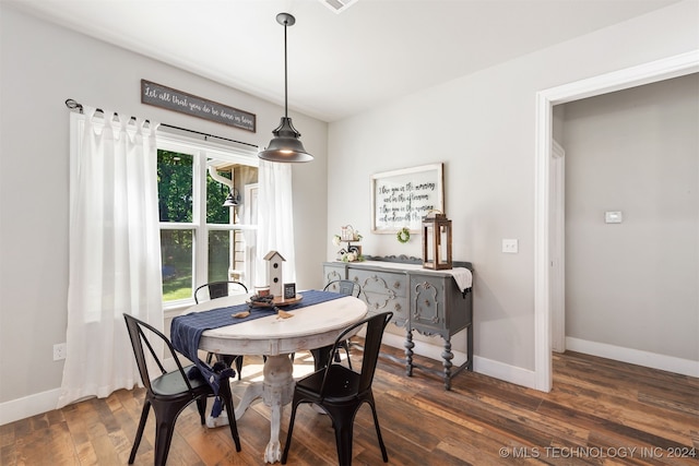 dining area featuring dark hardwood / wood-style floors