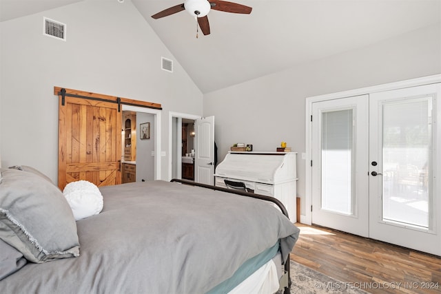 bedroom featuring french doors, ceiling fan, hardwood / wood-style flooring, and a barn door