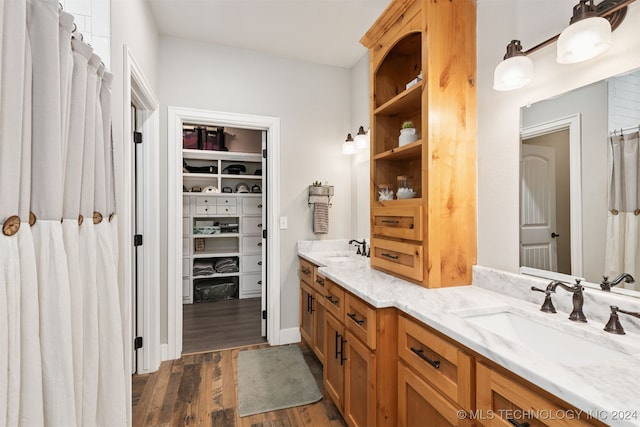 bathroom with vanity and hardwood / wood-style floors