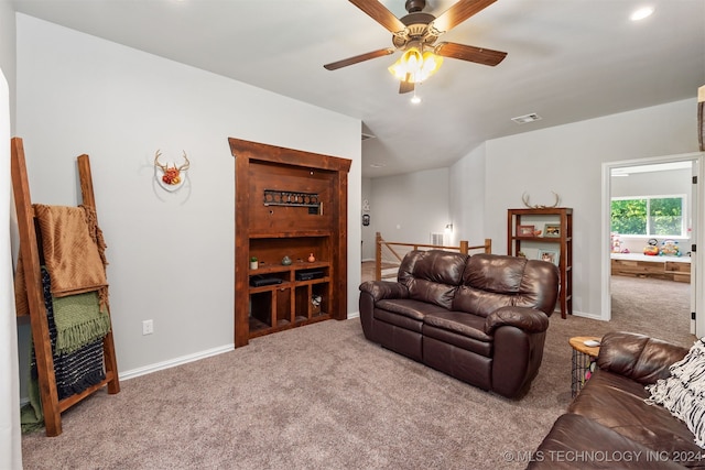 carpeted living room featuring ceiling fan