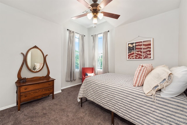 bedroom featuring dark colored carpet and ceiling fan