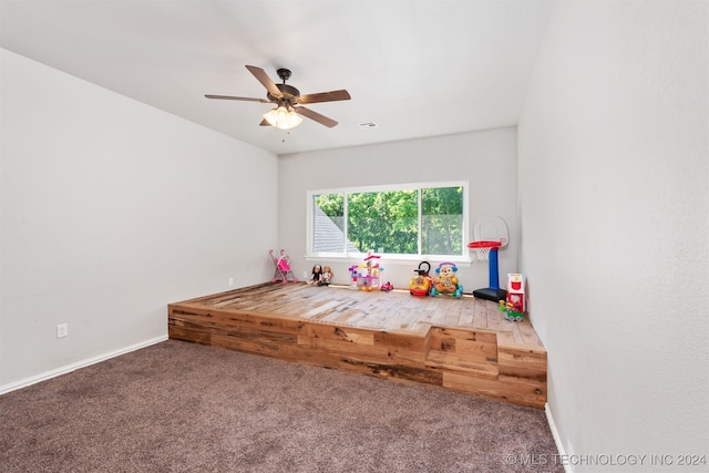 game room with ceiling fan and carpet flooring