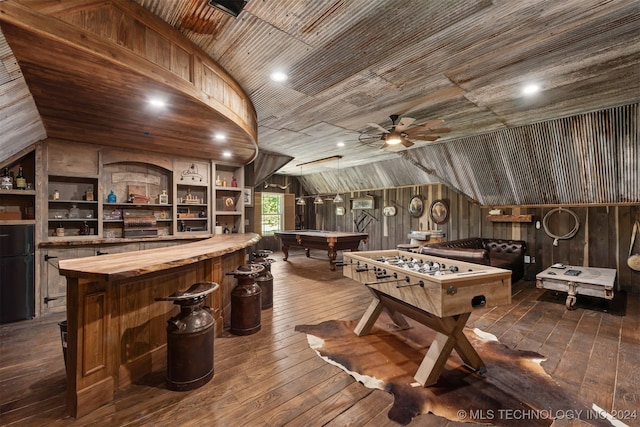 rec room with wood ceiling, wood-type flooring, vaulted ceiling, wood walls, and built in shelves