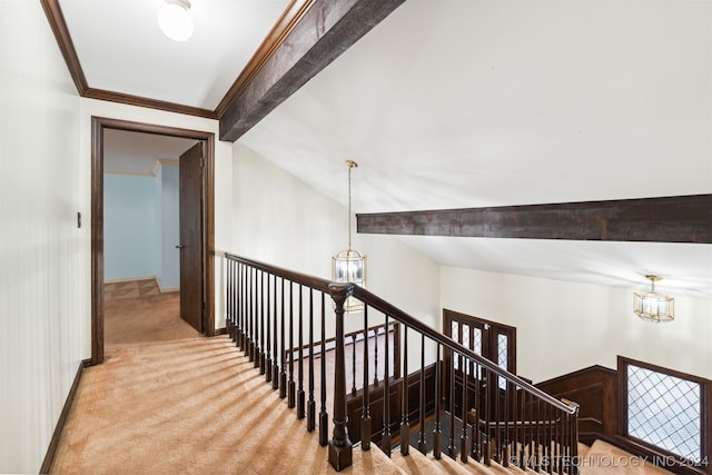 staircase featuring vaulted ceiling with beams, a chandelier, and carpet flooring