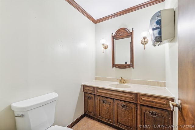 bathroom featuring vanity, crown molding, and toilet