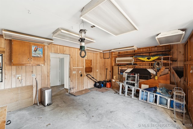 garage featuring wood walls