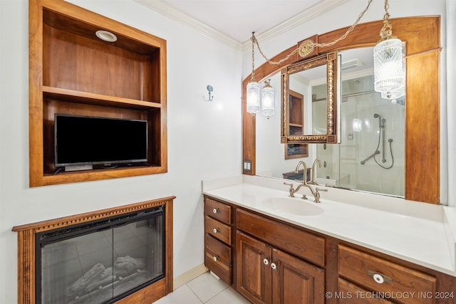 bathroom with vanity, ornamental molding, a shower with shower door, and tile patterned floors