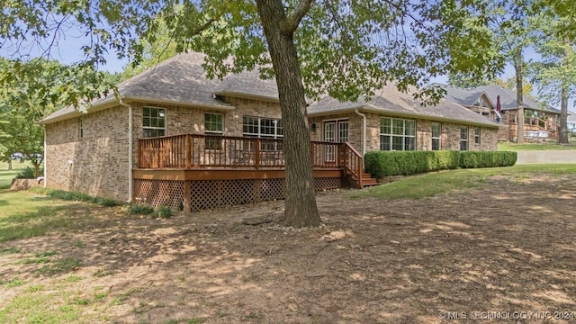 back of property featuring a deck