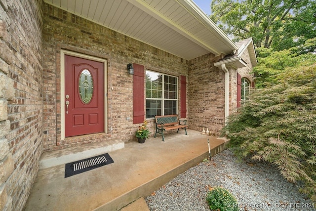 property entrance with covered porch