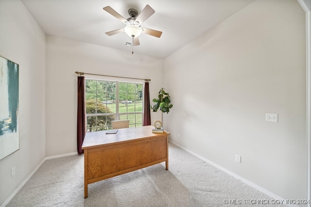 carpeted home office with ceiling fan