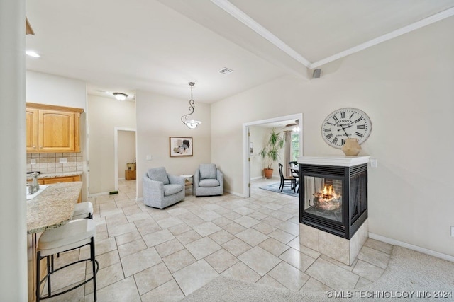 tiled living room with a multi sided fireplace and beam ceiling