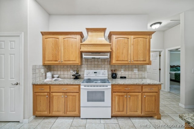 kitchen with backsplash, electric range, light stone counters, extractor fan, and light tile patterned floors