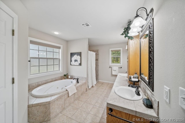 bathroom featuring vanity, tile patterned floors, and separate shower and tub