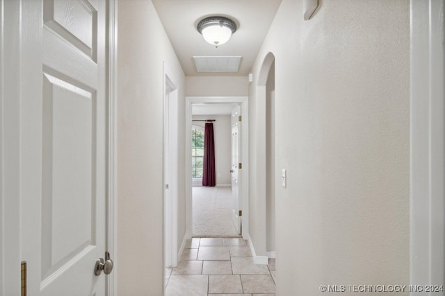 hall with light tile patterned flooring