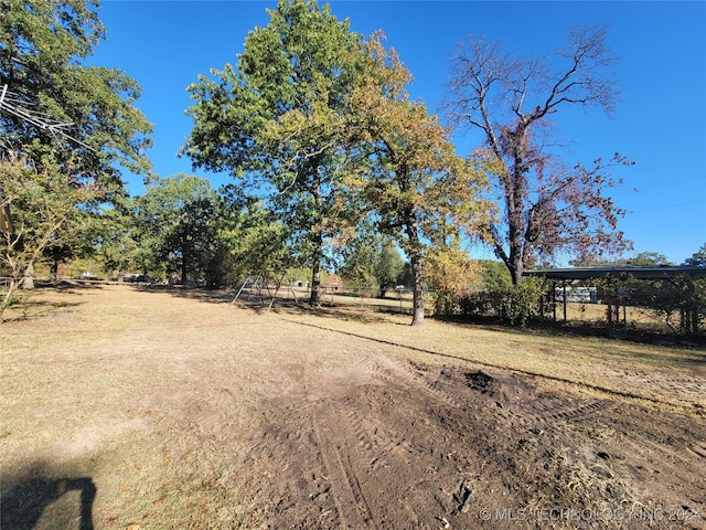 view of yard with a rural view