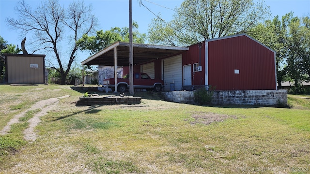 view of outdoor structure featuring a lawn and a carport